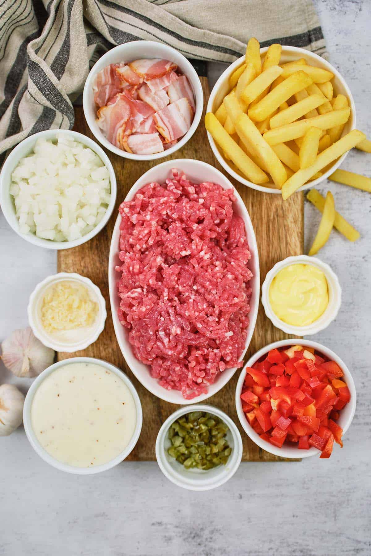 ingredients to make french fry casserole laid out on a table