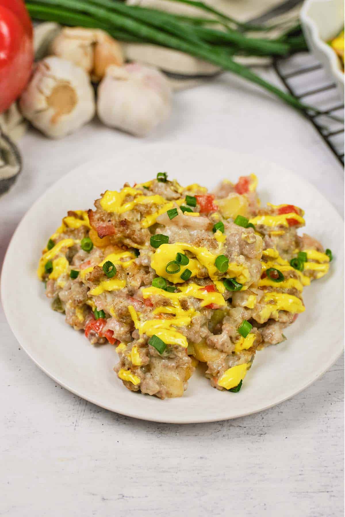 plate with a serving of french fry casserole ready to enjoy