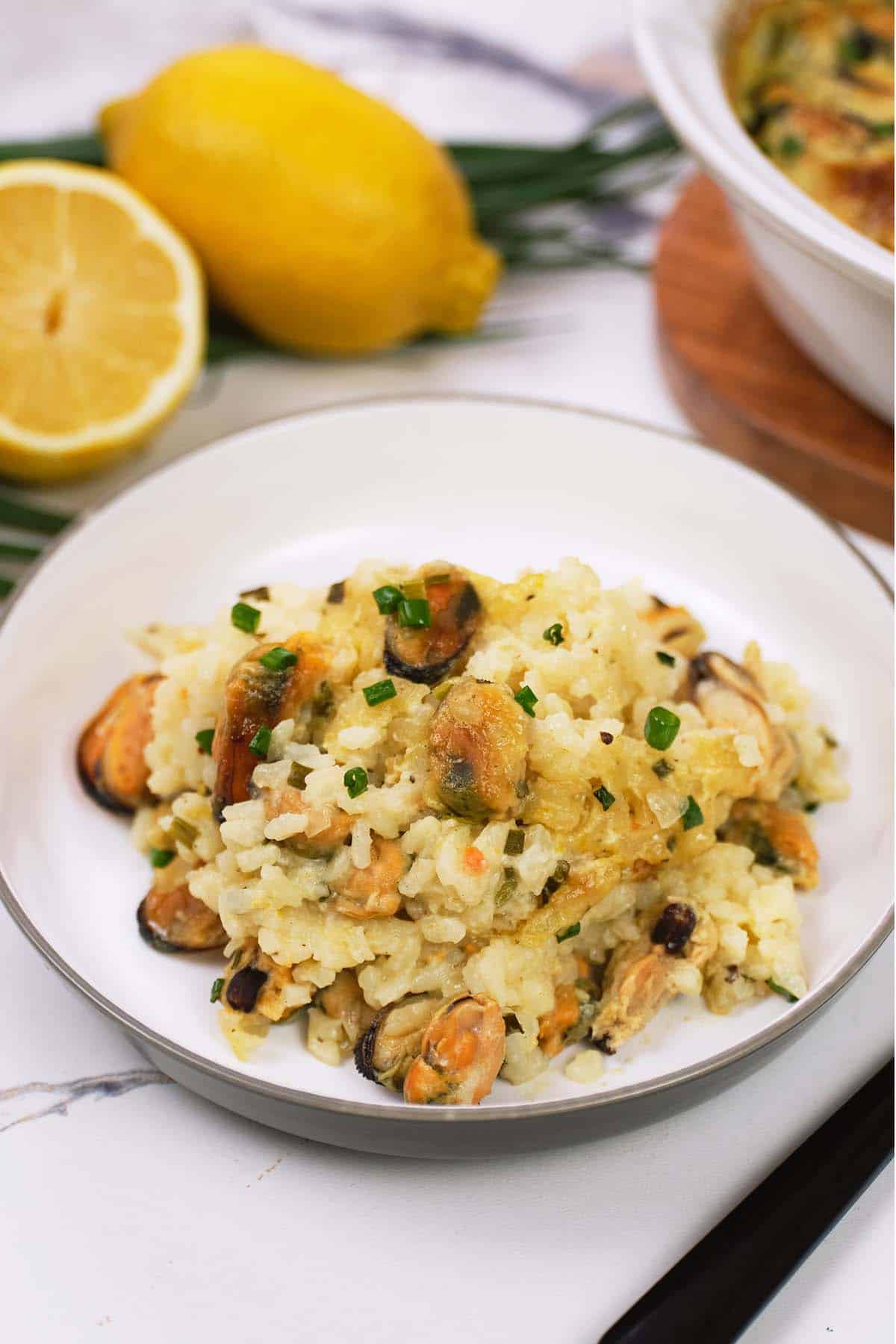 serving of greek rice and mussel casserole on a plate ready to enjoy