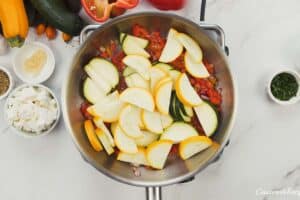 sauteeing vegetable slices to make greek vegetable casserole