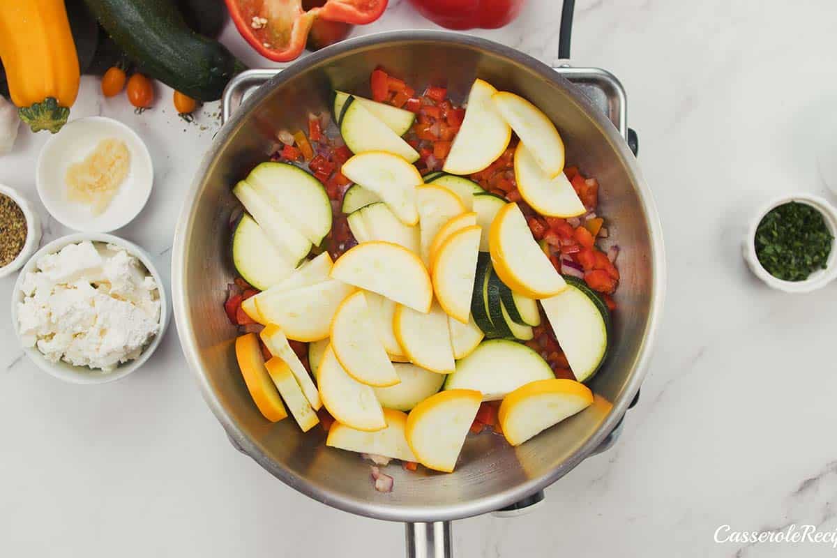 sauteeing vegetable slices to make greek vegetable casserole