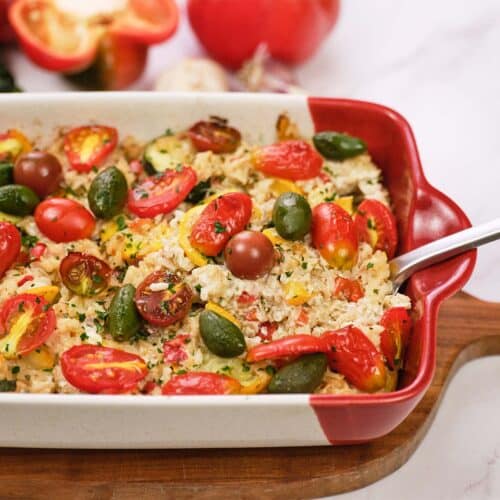 baking dish of greek vegetable casserole being served fresh from the oven