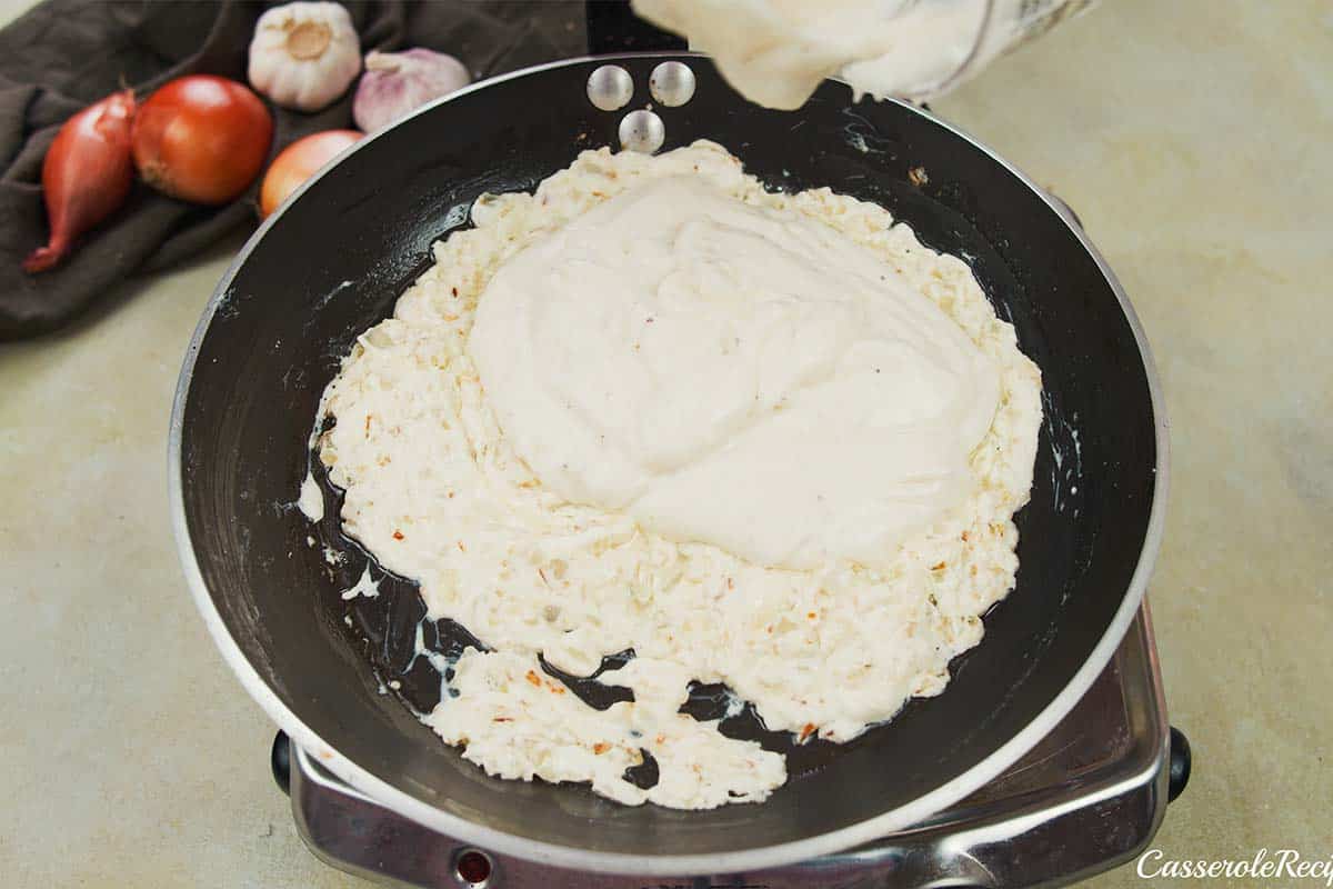 combining ingredients to make no-peek chicken casserole sauce