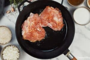 chicken being cooked to make One Pot Caribbean Jerk Chicken & Rice