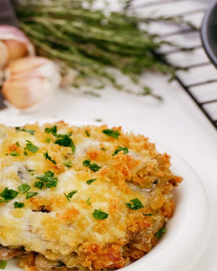 easy stuffed mushroom casserole served on a plate ready to enjoy