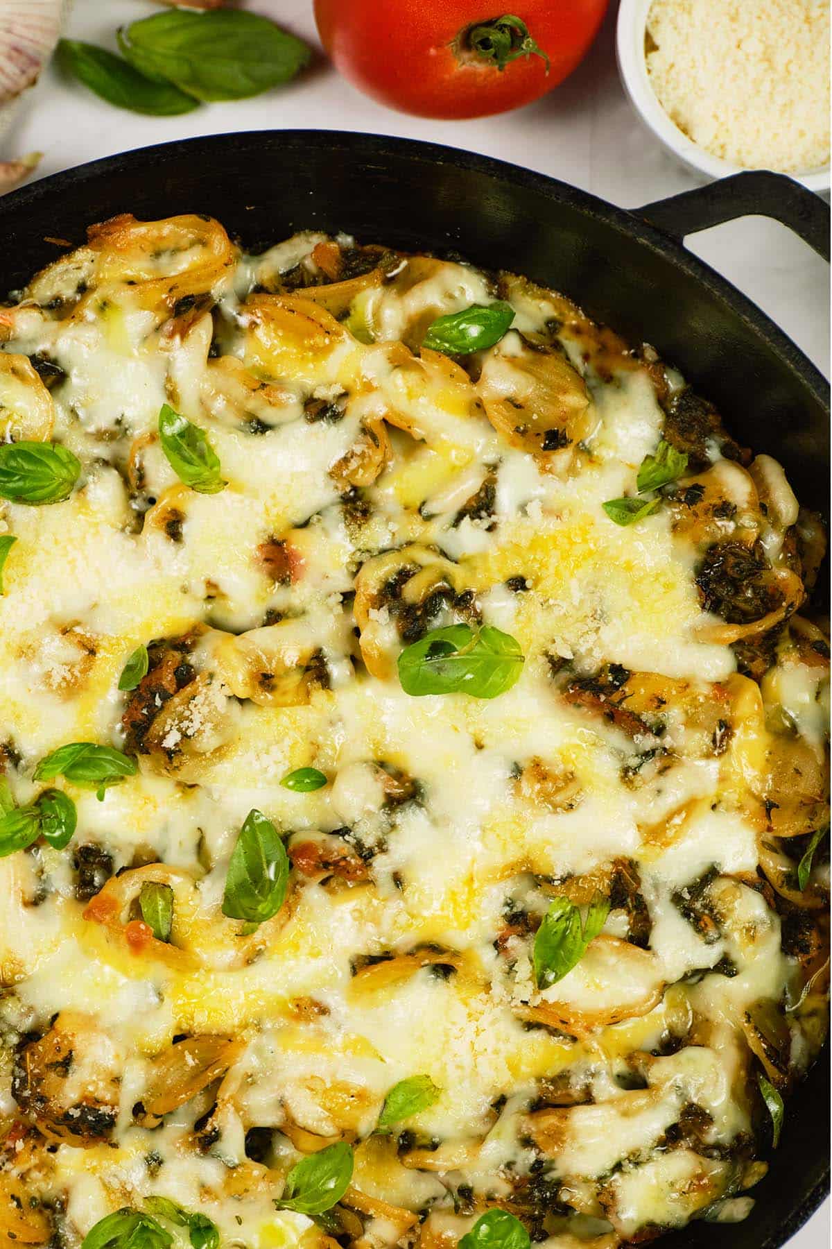 closeup of ready to serve Baked Orecchiette with Spinach in a pan