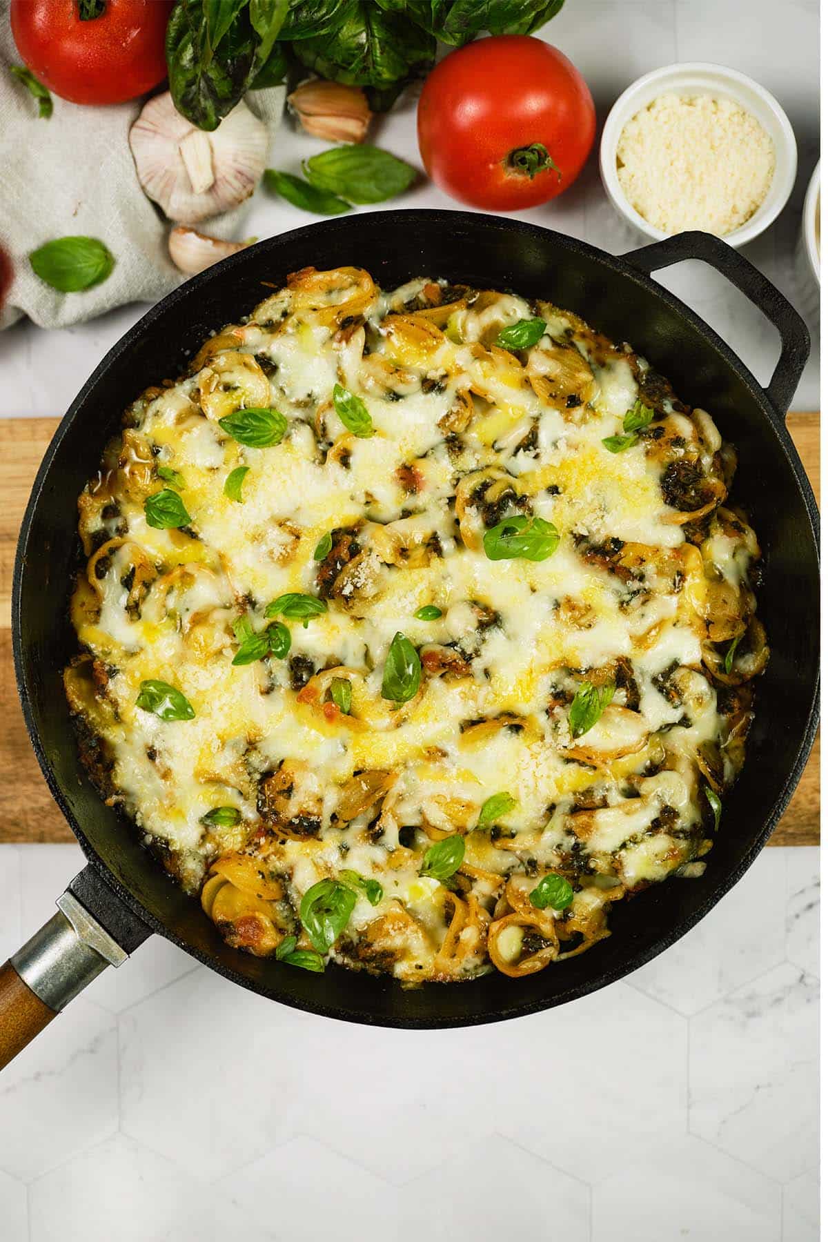 overhead view of a pan of Baked Orecchiette with Spinach ready to serve