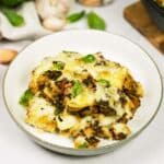 Baked Orecchiette with Spinach in a bowl on a table ready to enjoy