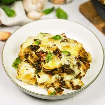 Baked Orecchiette with Spinach in a bowl on a table ready to enjoy
